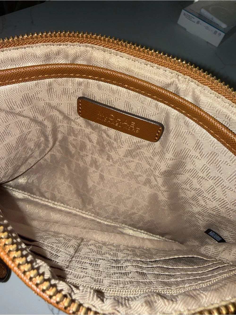 Michael Kors Beige MK Monogram clutch/wristlet with Brown Trim